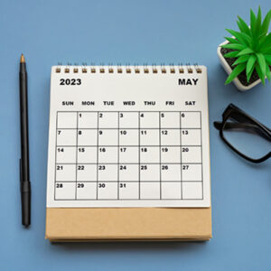 Photo of a 2023 calendar on a desk.